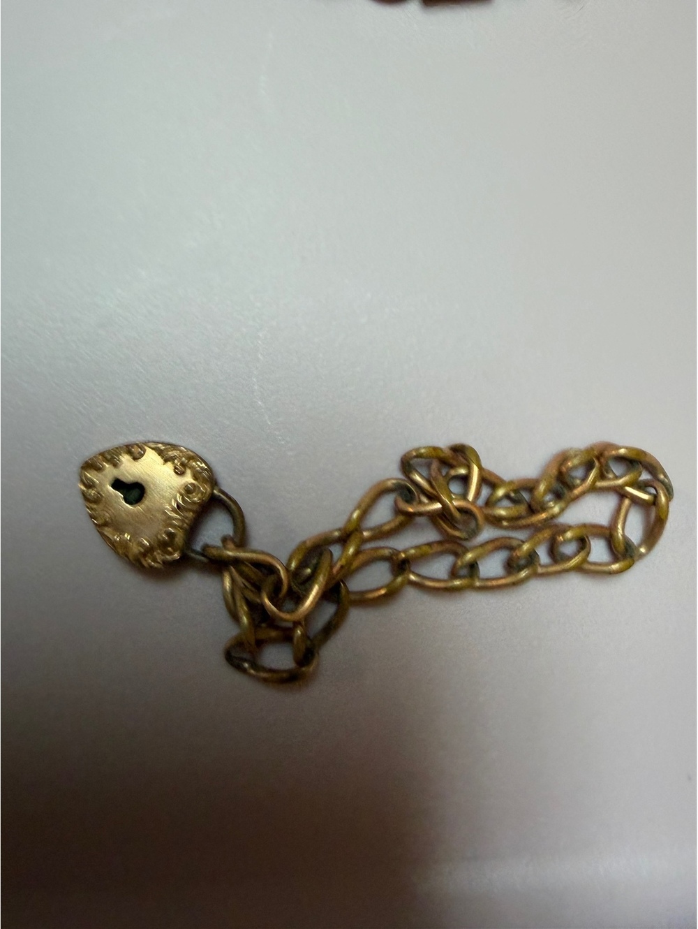 Gold tone heart charm chain